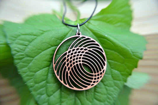 Interlocking Circles Pendant in cherry on leather cord